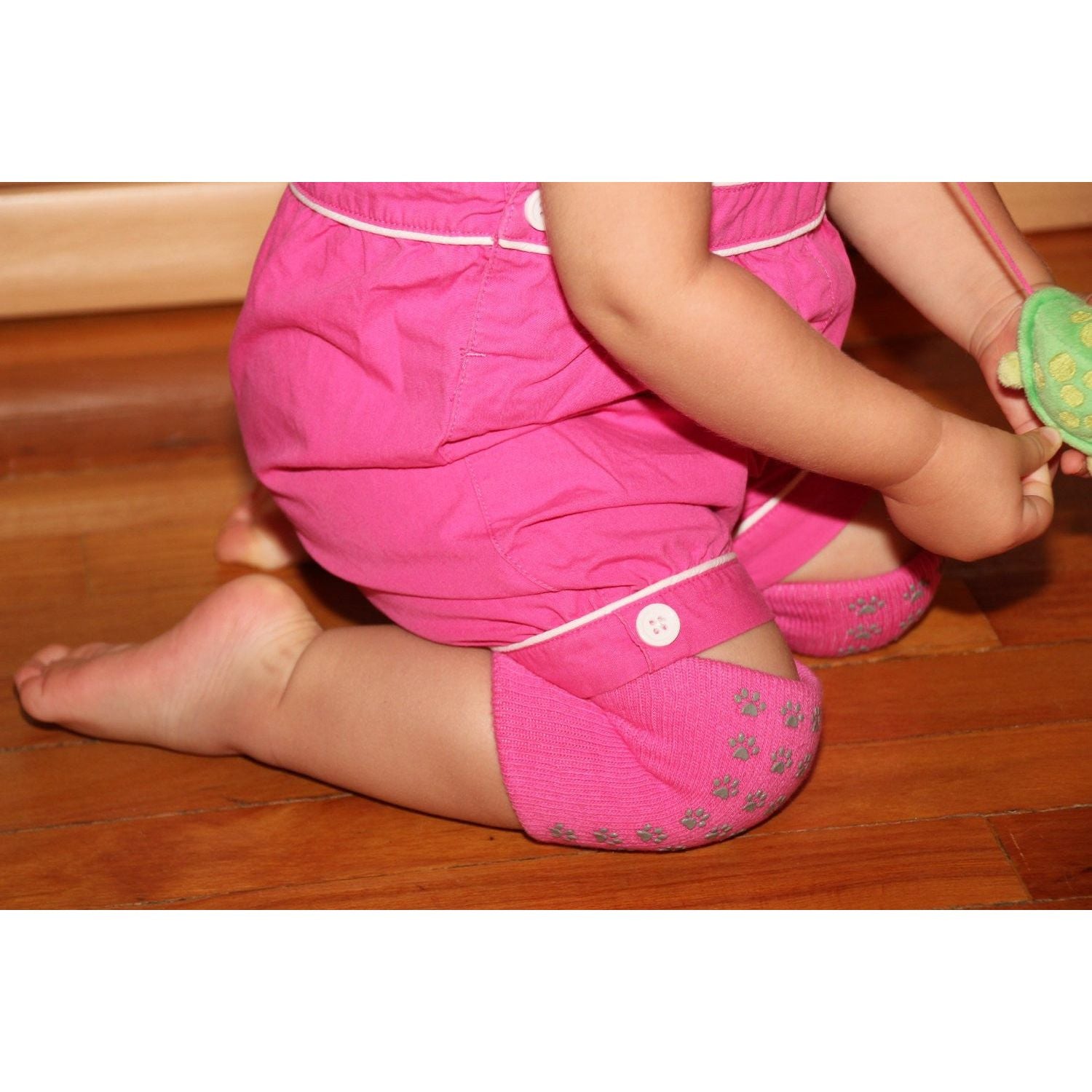 soft pink knee pads with rubber traction paws for girls